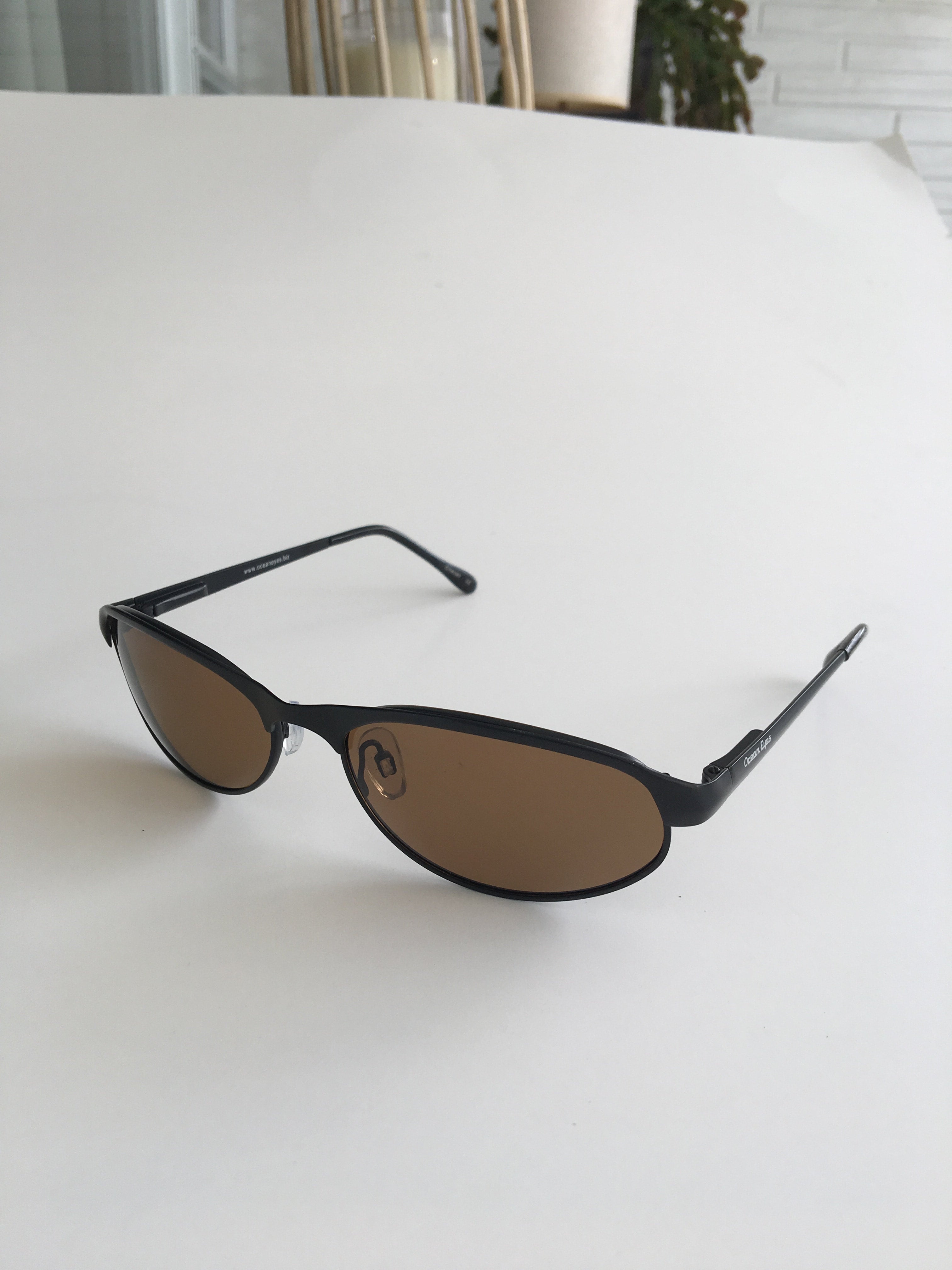 Rip Tide - Matte Black Metal Frame with Amber Lenses  2010